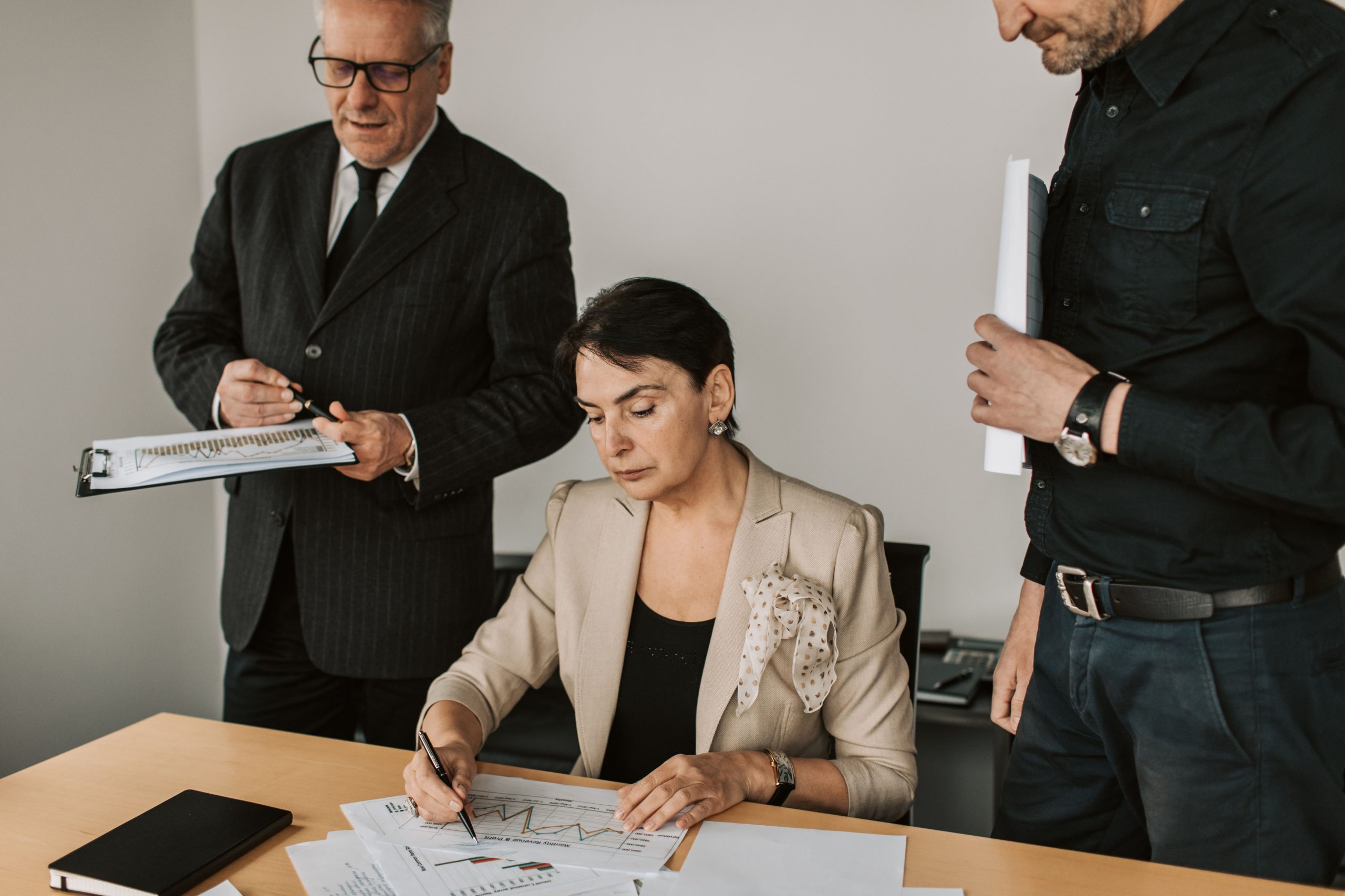 professional-services-financial-documents Business professionals collaborating on financial documents in an office setting